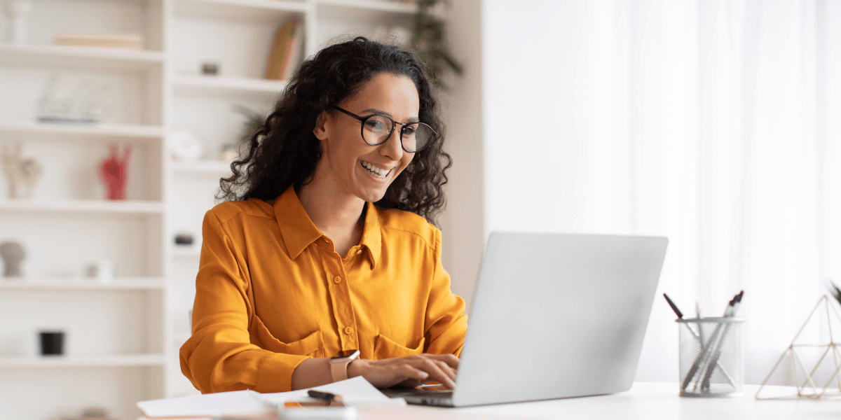 person smiling at computer