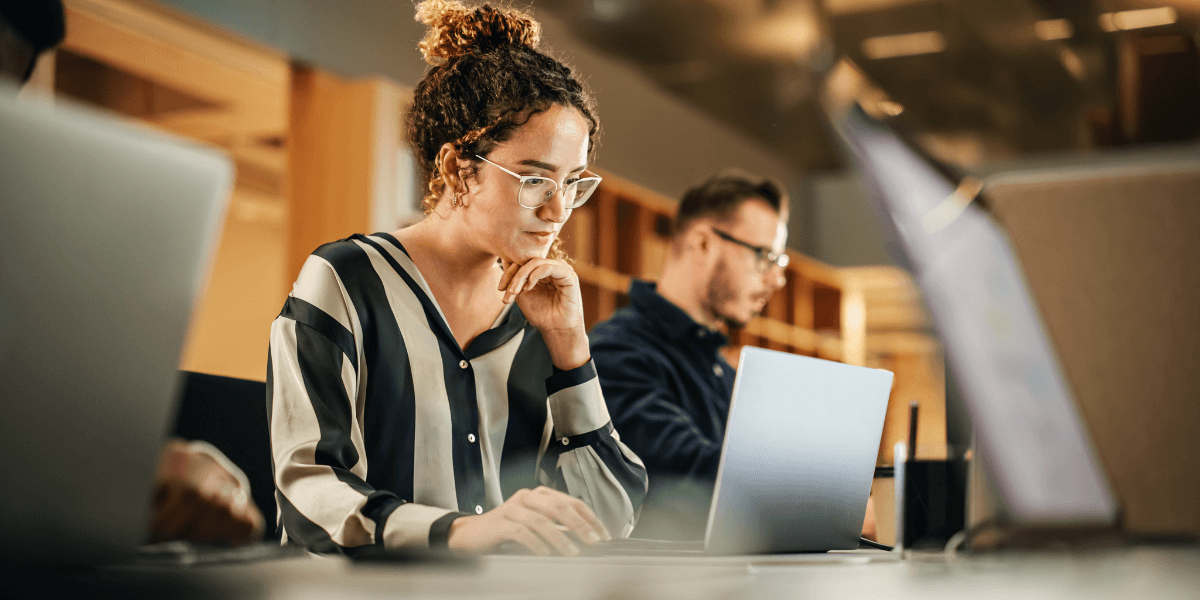 person looking at her laptop