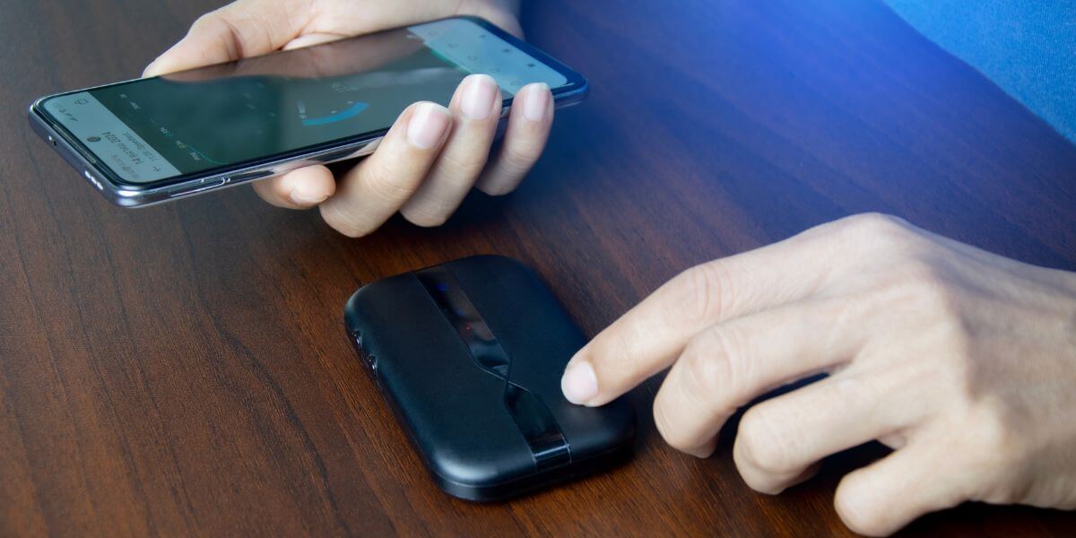 person using phone and hotspot