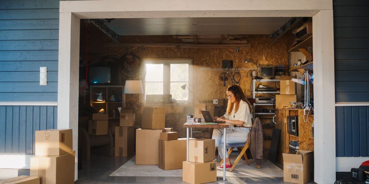 woman using laptop in garage