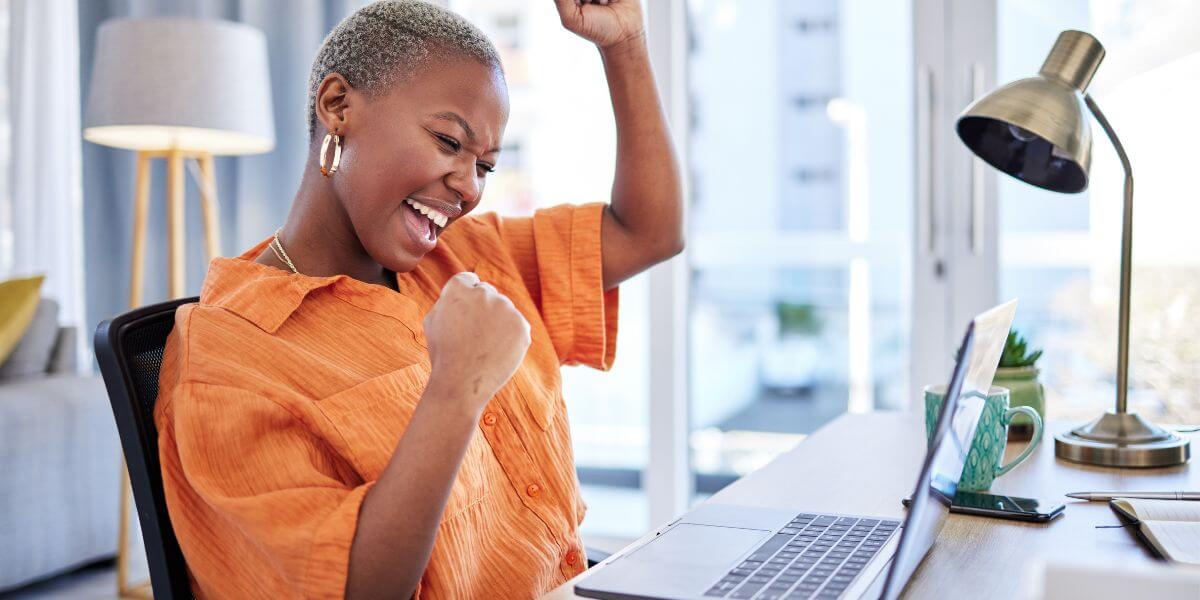 happy woman using laptop