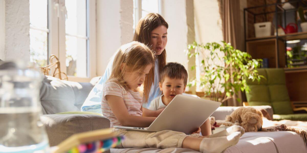 woman and kids using tablet