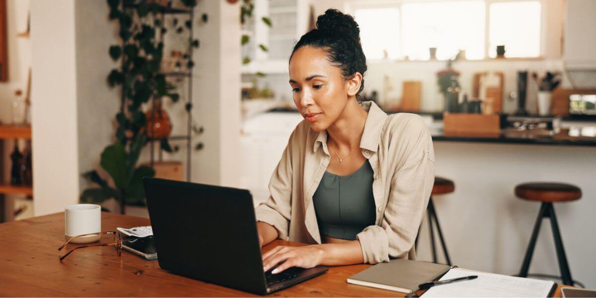 woman using laptop at table