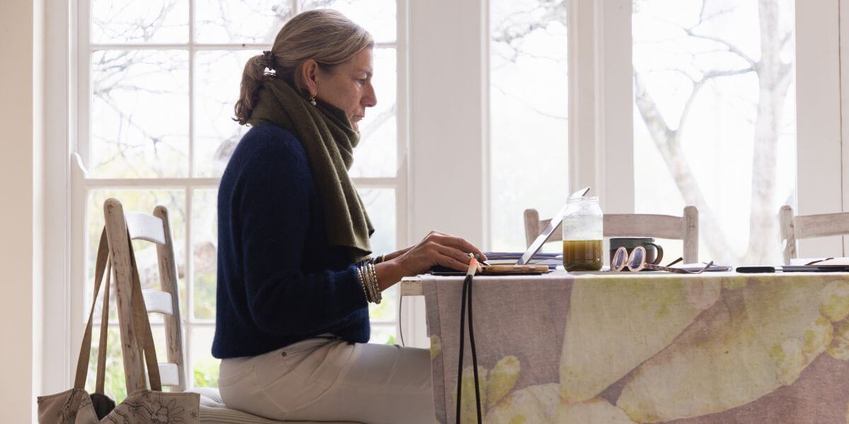 woman using laptop at table