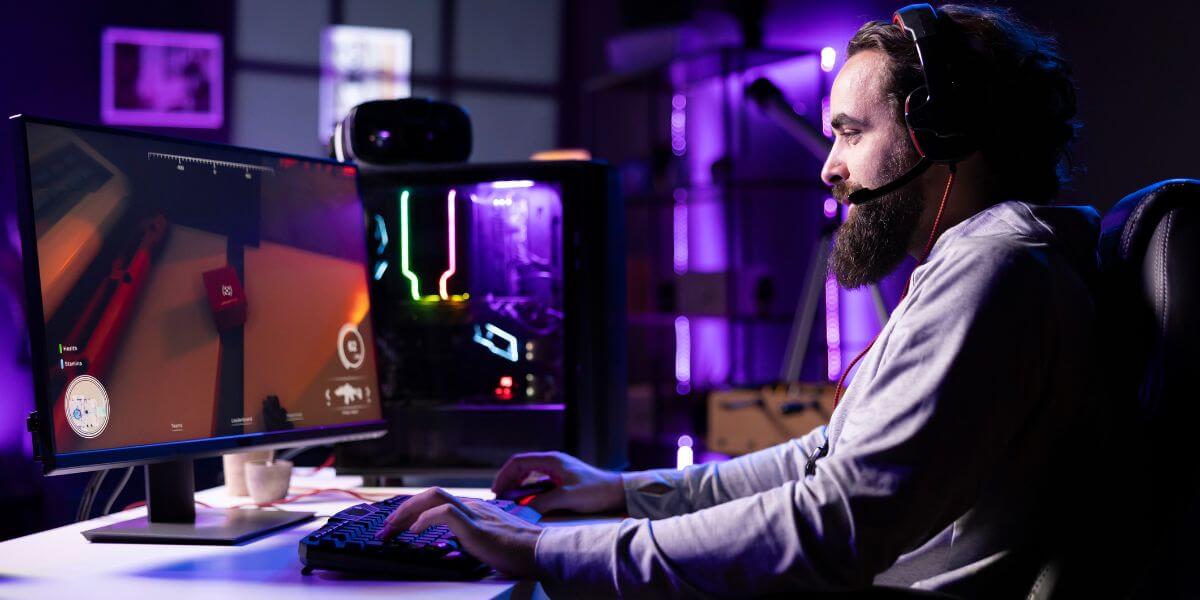 man gaming on pc