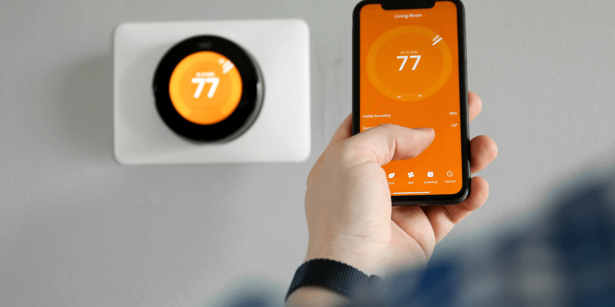 smart thermostat connected to a phone