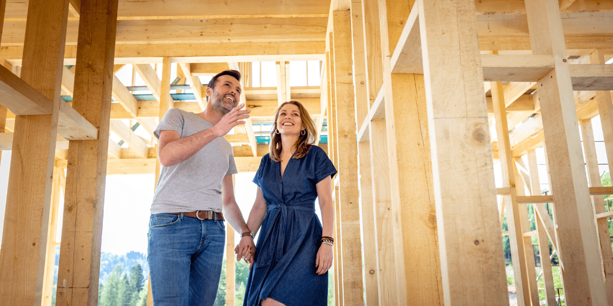 people walking through their new construction home