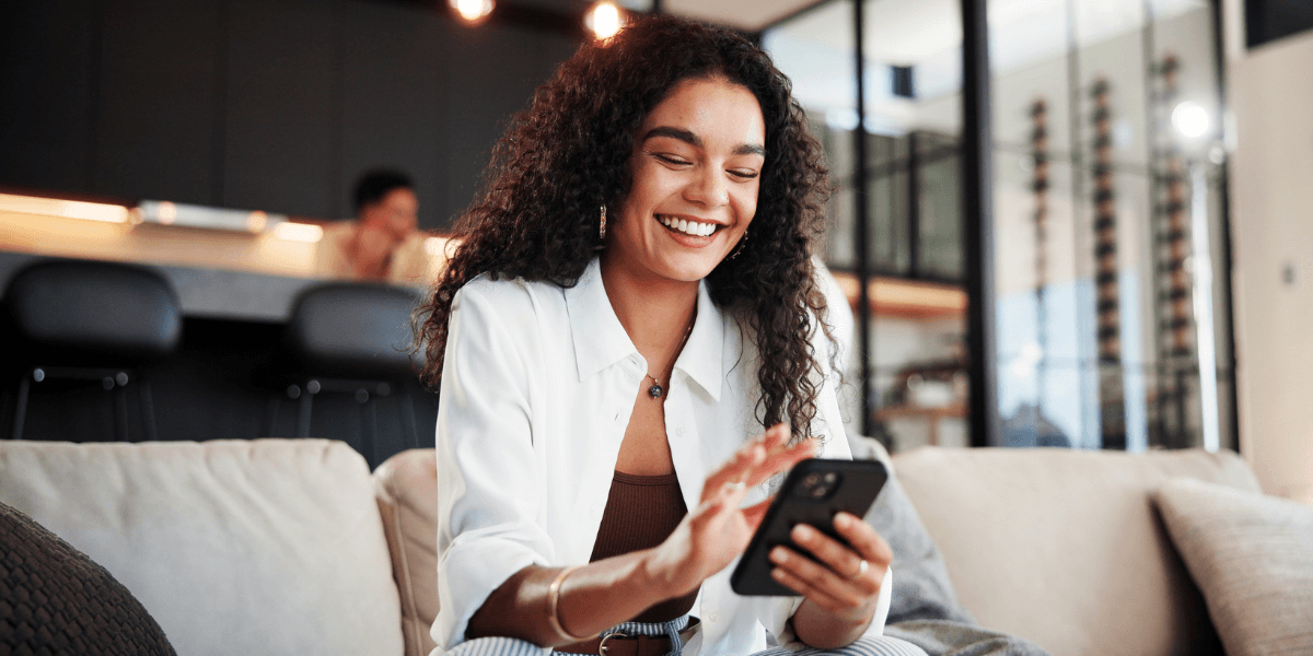 girl smiling at her phone