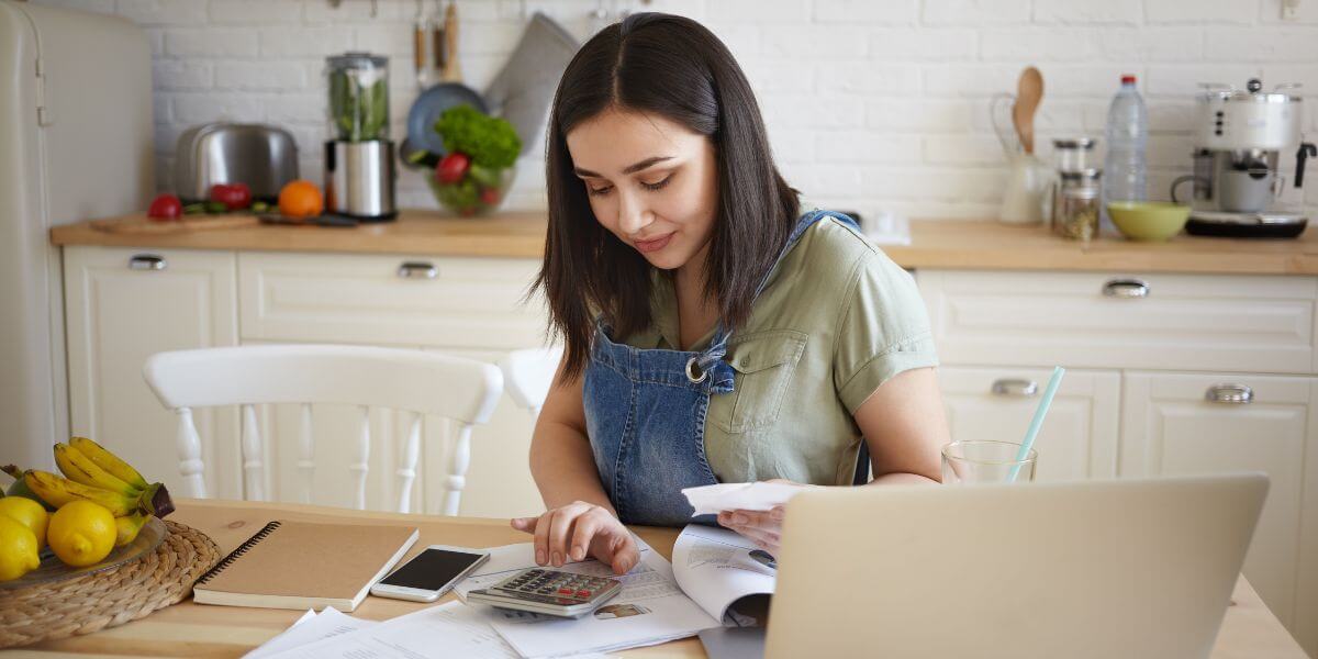 woman paying bills on laptop