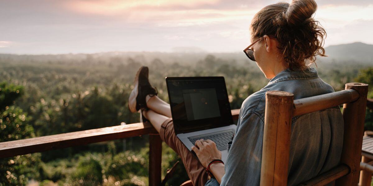 woman using laptop outside