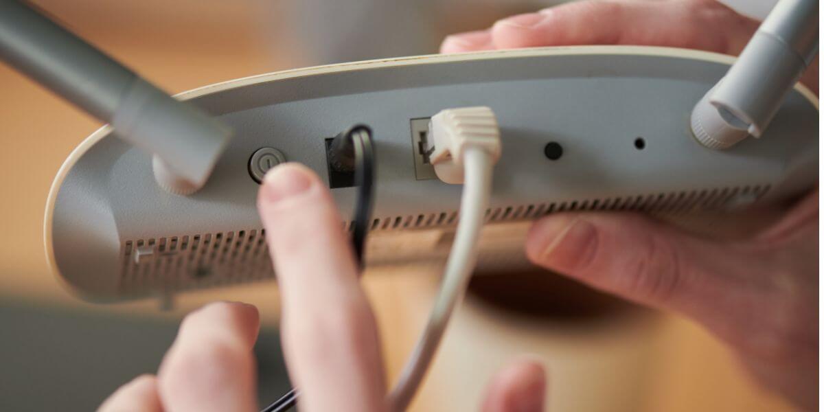 person fixing modem