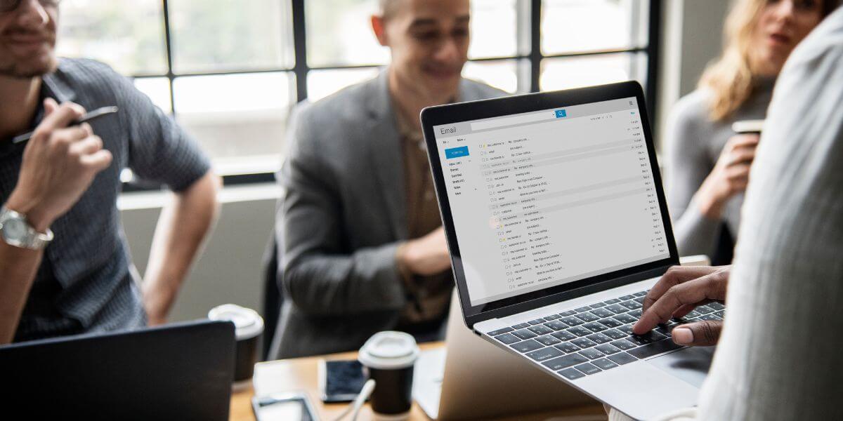 person checking email on laptop