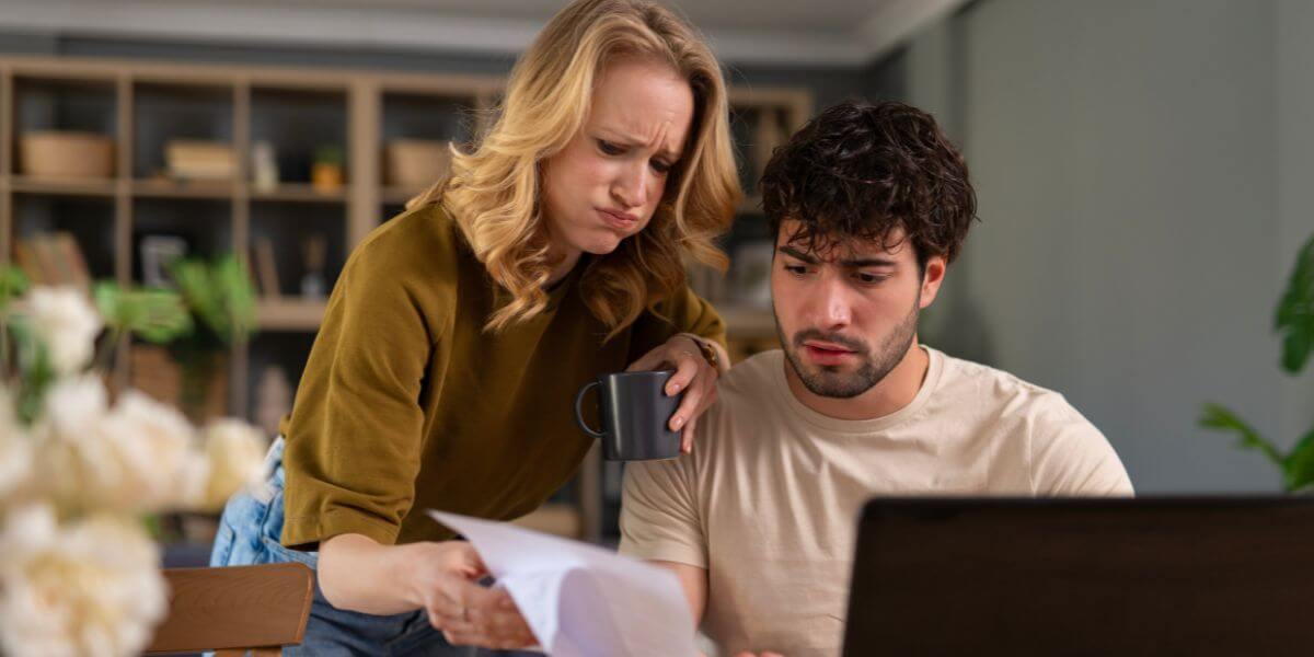 couple looking at bills