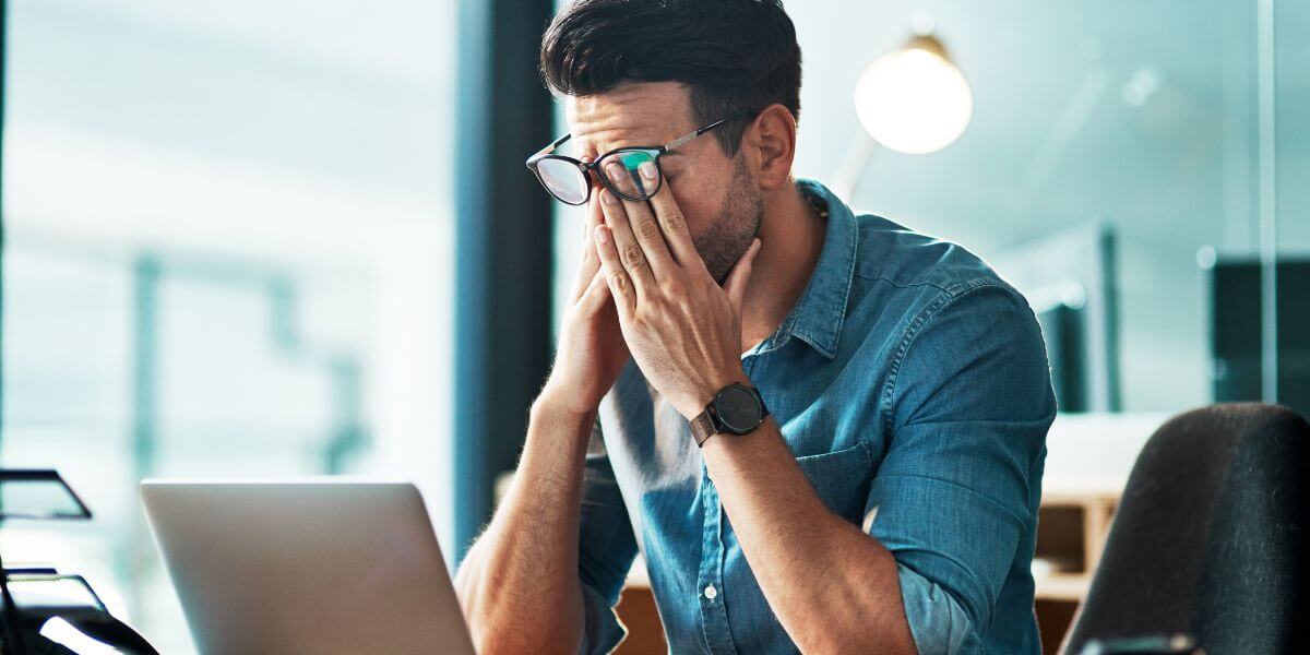 frustrated man with laptop