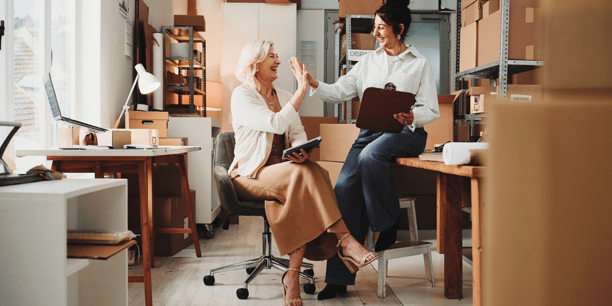 small business owners high-fiving