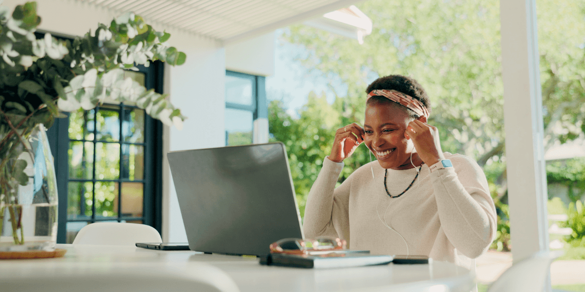 person working on laptop smiling