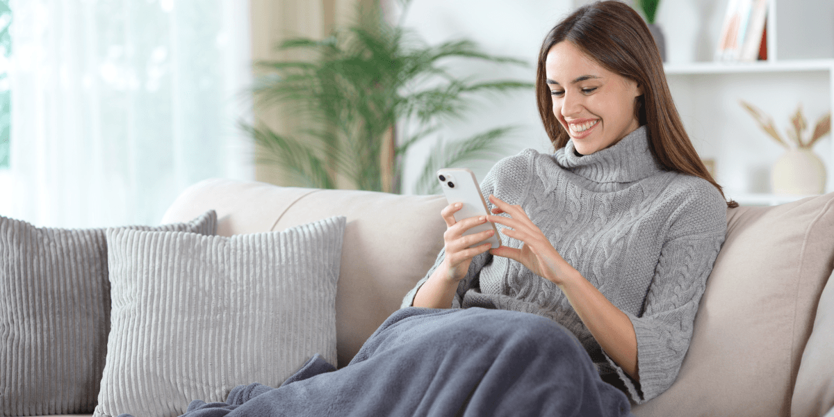 woman using phone in apartment