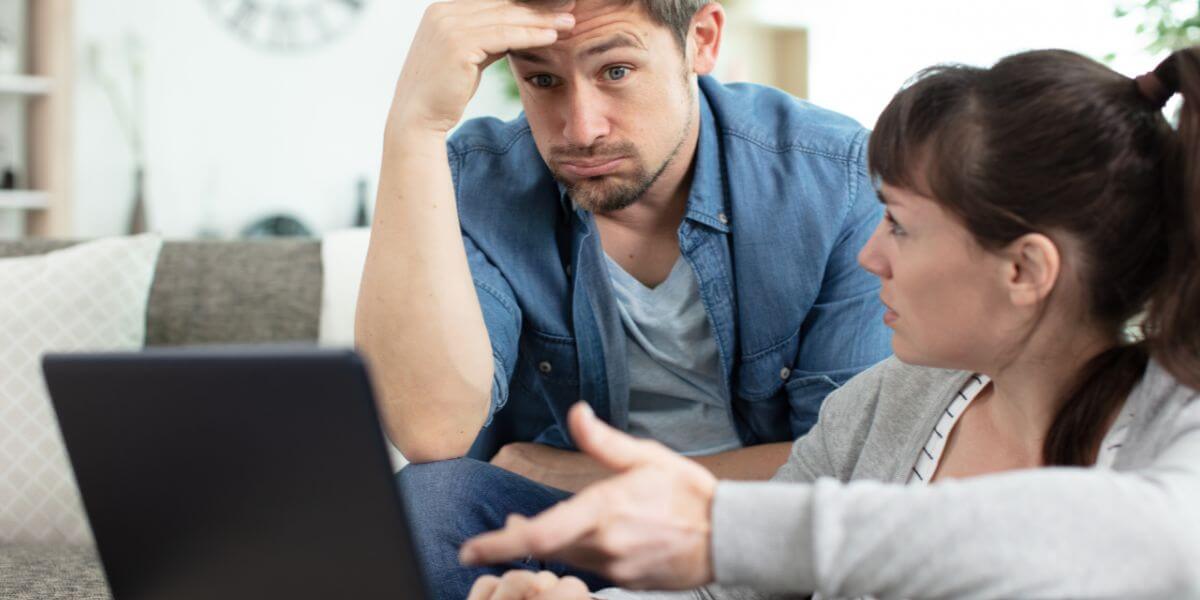 couple using laptop