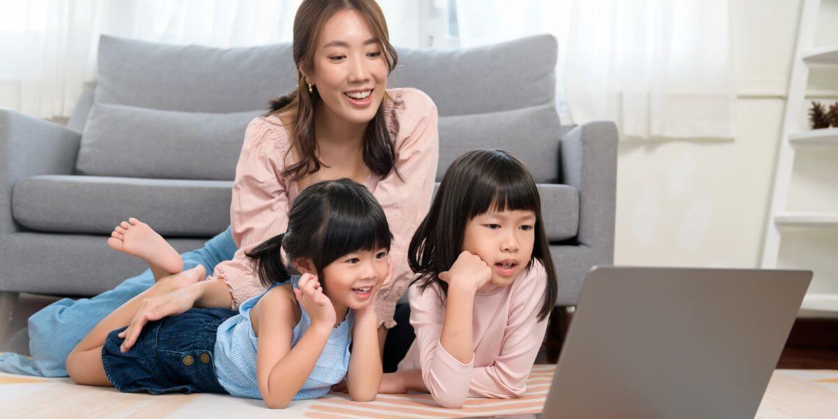 family watching laptop