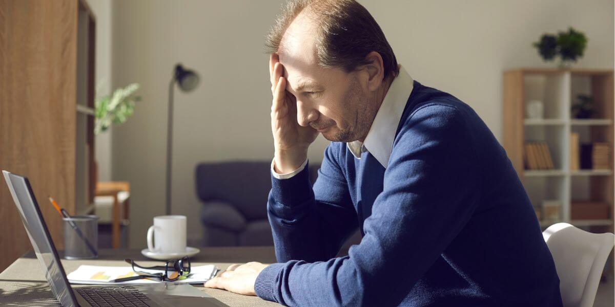 frustrated man at laptop