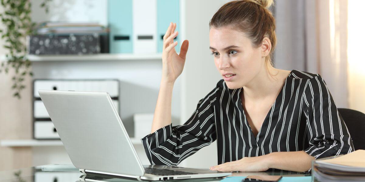 frustrated woman at laptop