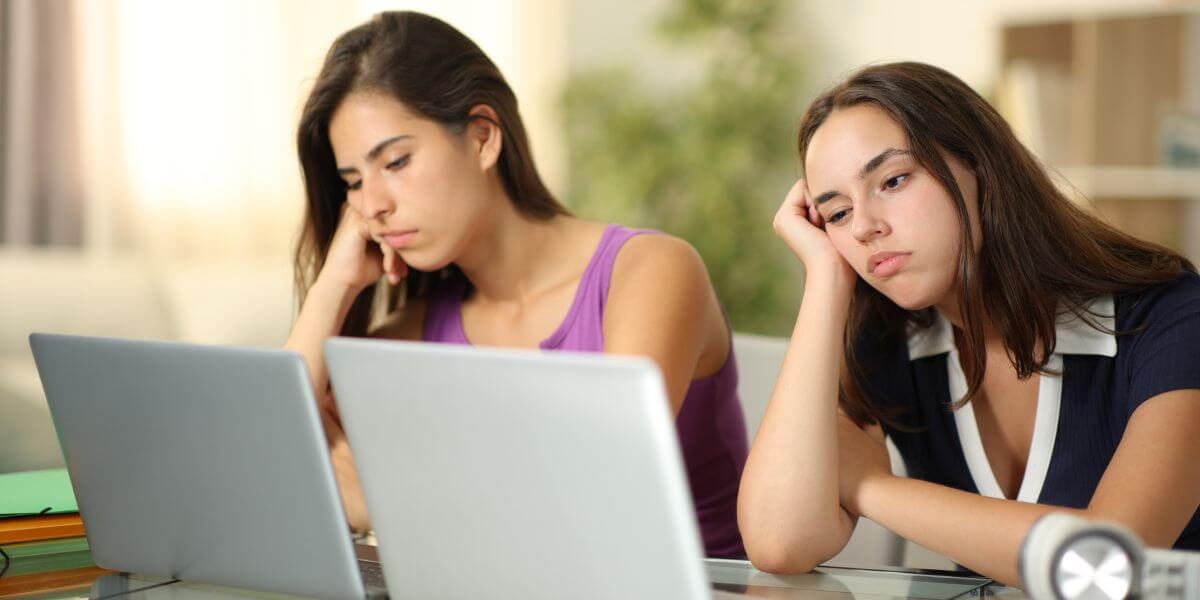 frustrated women at laptops