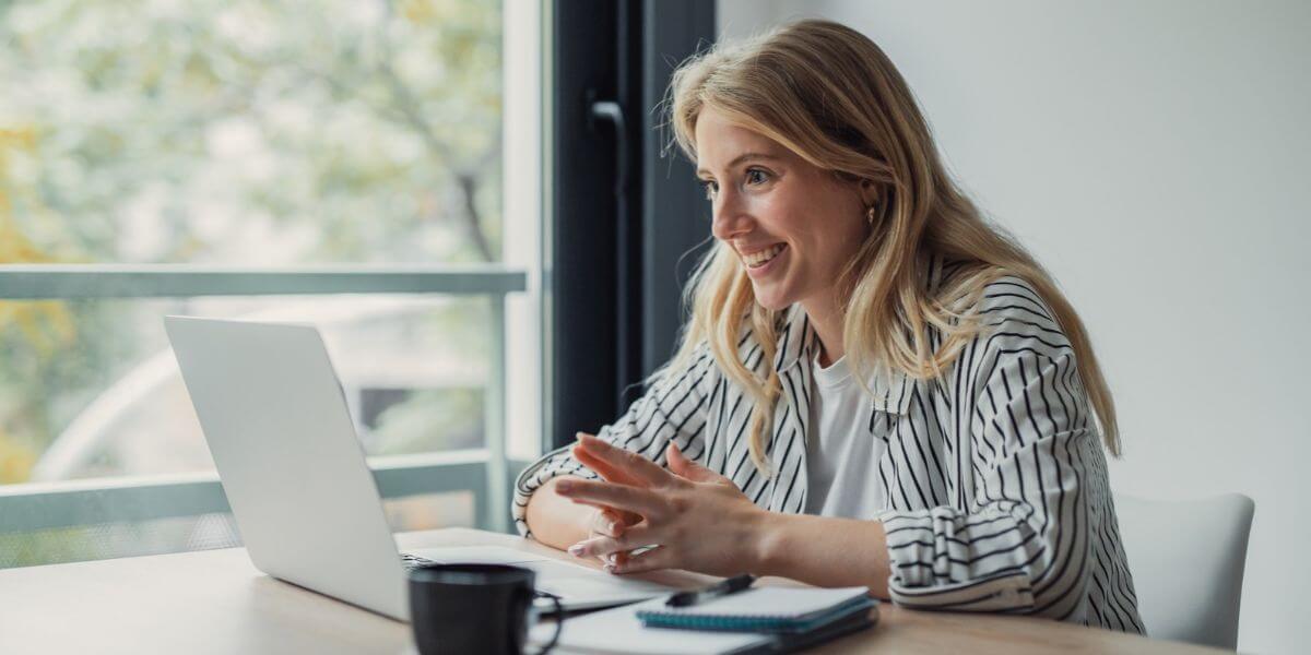 woman on meeting using laptop