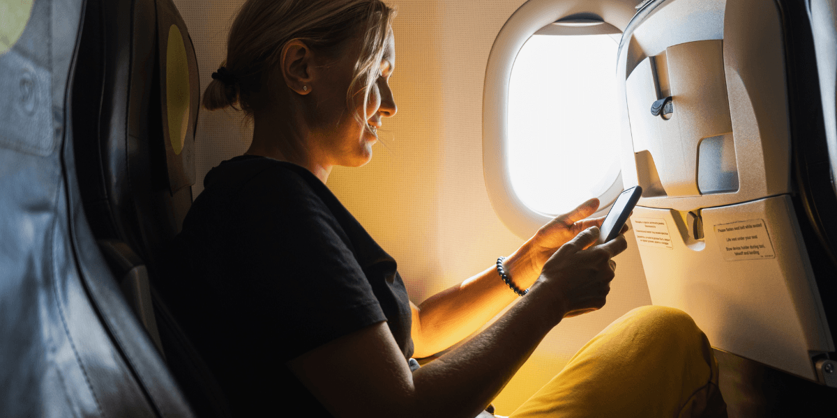 woman using internet on a plane