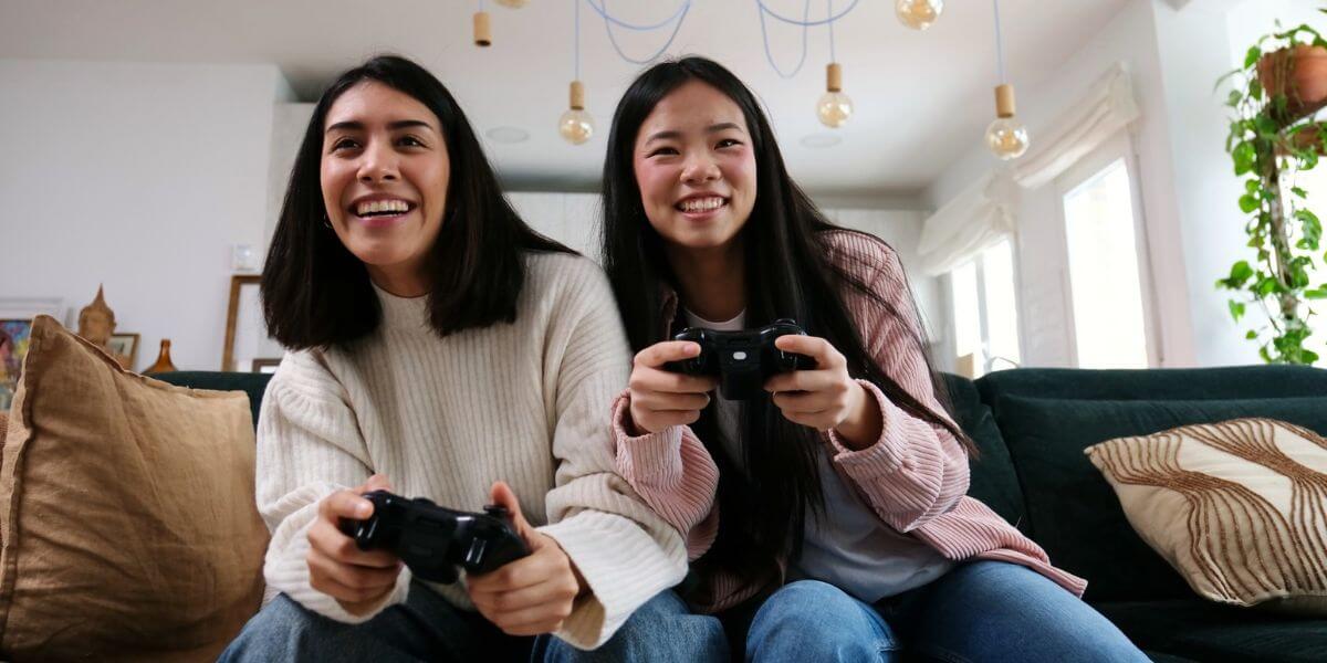 people playing video games on couch