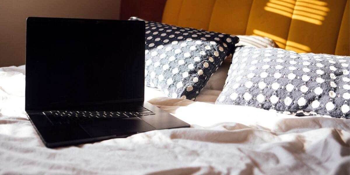 laptop on bed