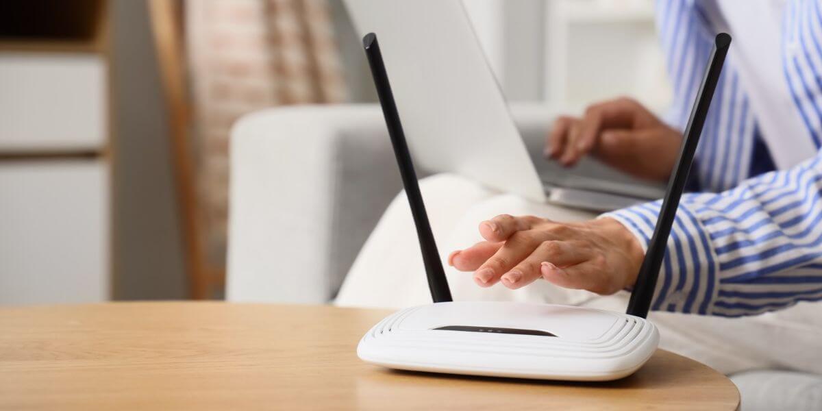 person fixing router