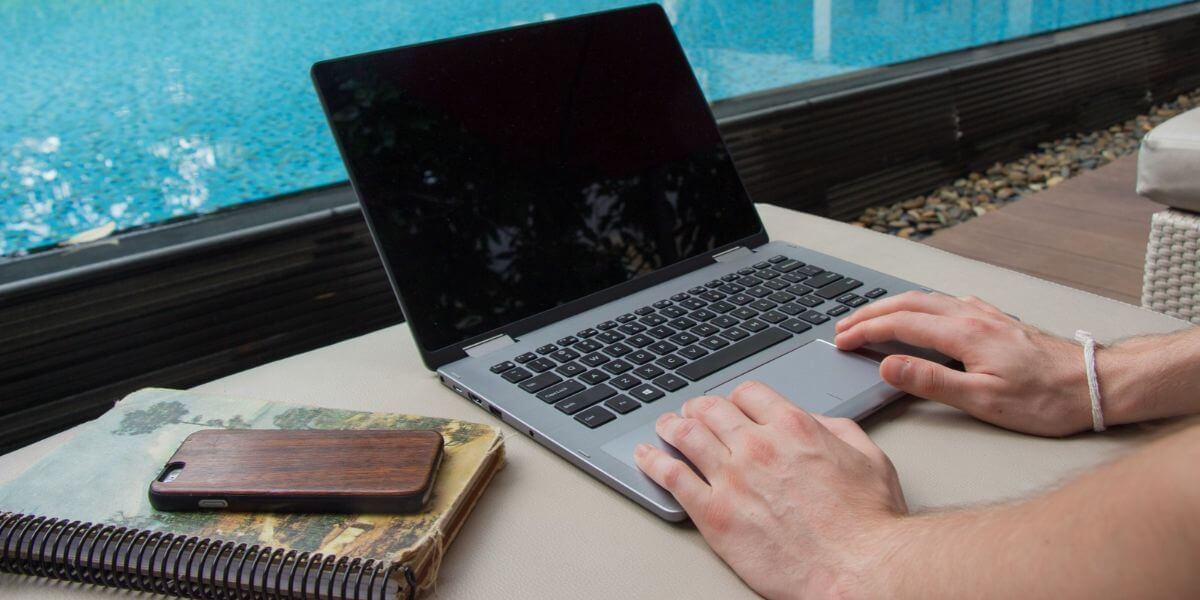 person using laptop net to pool