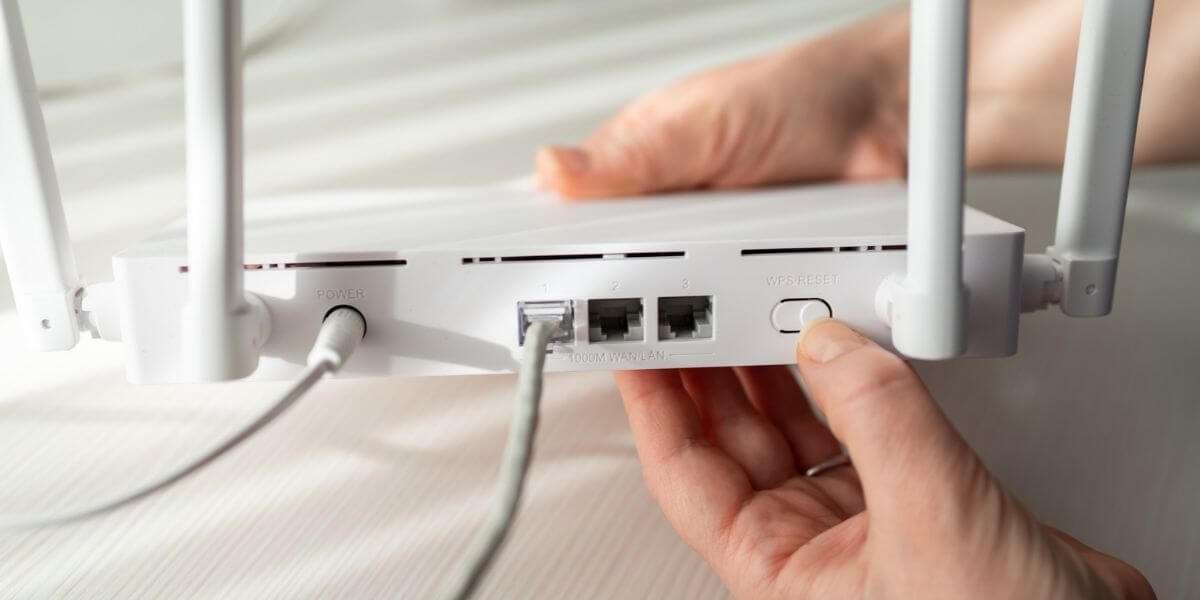 person resetting router