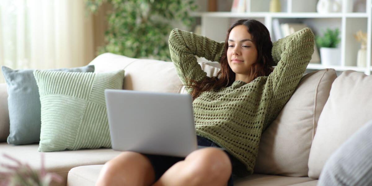 woman on couch with laptop