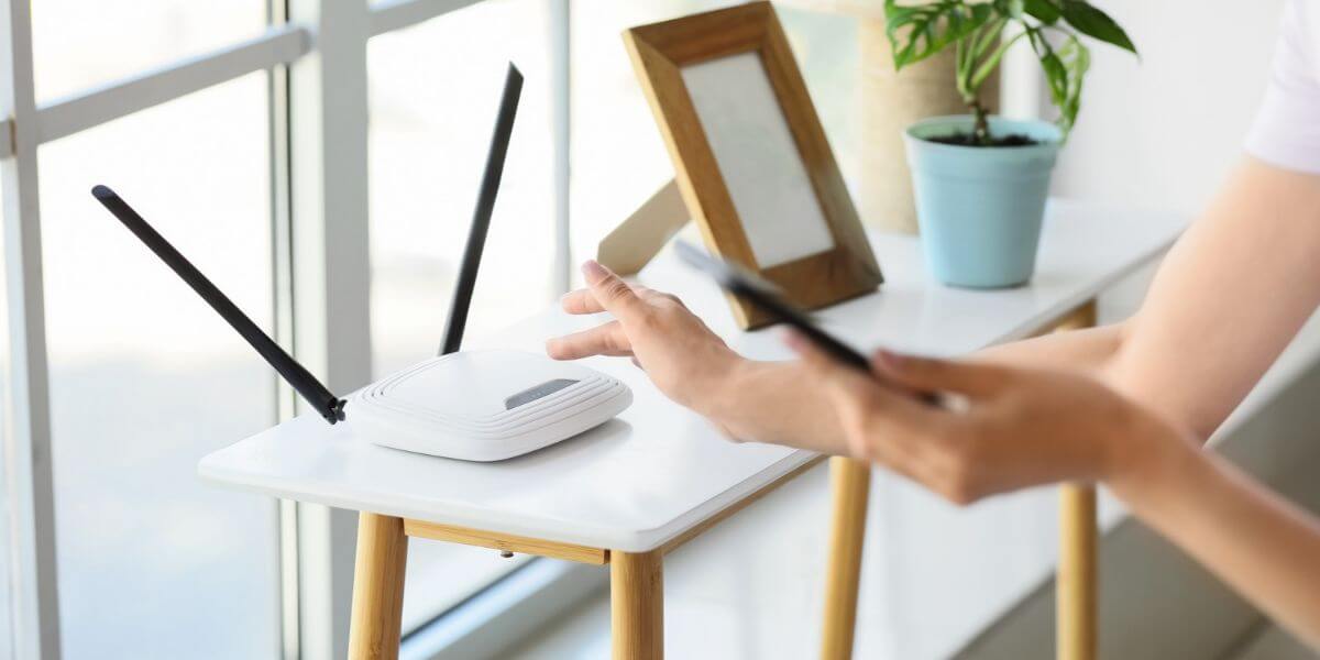 \person with phone and router